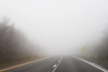 Zelfklevend Fotobehang foggy highway © Tom