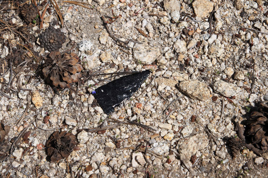 broken arrowhead on ground