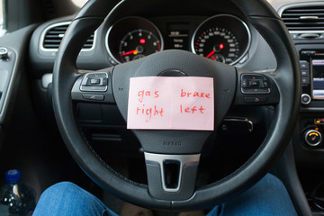 sheets of paper with a reminder where the gas, and where to brake the car
