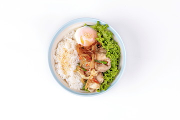 Japanese rice topped boil eggs and fried pork.