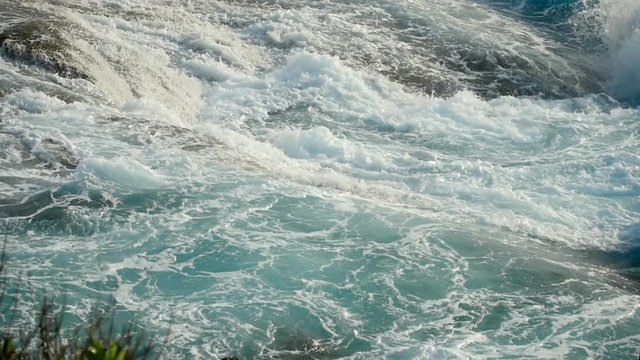 Turquoise rolling wave, slow motion
