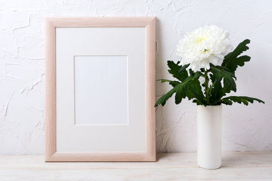 Wooden frame mockup with white chrysanthemum in vase