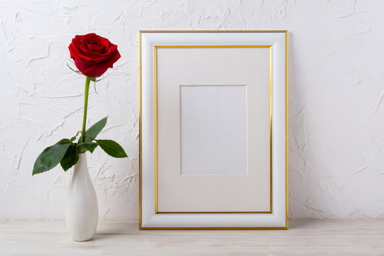 Frame mockup with red rose in elegant vase