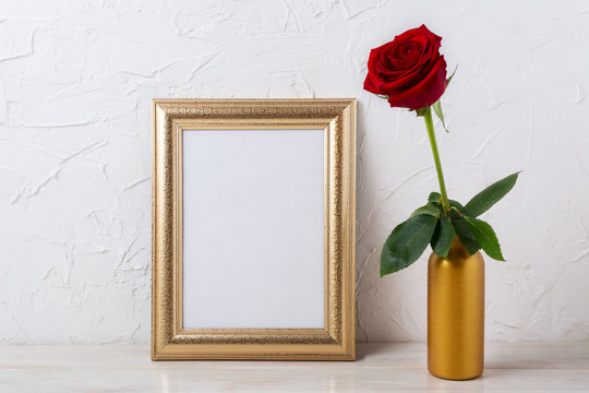 Gold frame mockup with dark red rose in vase