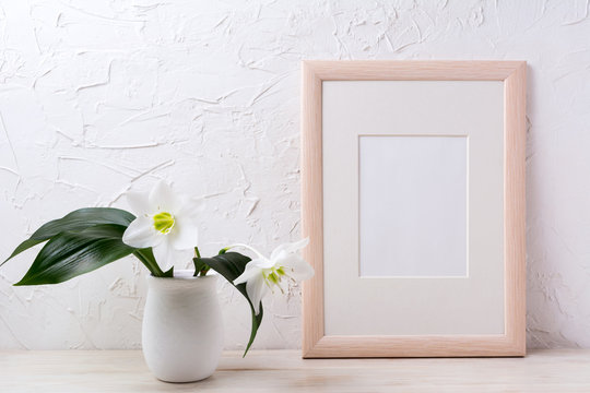 Wooden frame mockup with white lily in flower pot