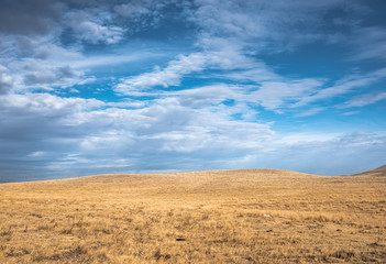 Fototapeta na wymiar Blue sky over wide open Wyoming prairie