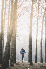  man running on the forest.