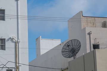 Satellite dish on top of downtown building
