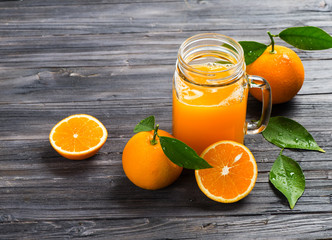 Mason jar mug with orange juice.
