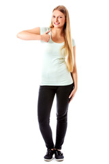 Fototapeta premium Beautiful teenage girl smiling and doing the thumbs-up sign.