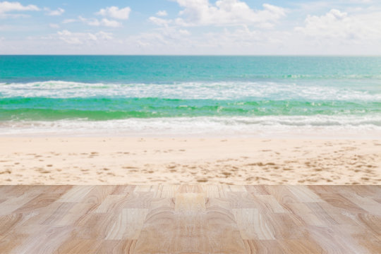 Wood table floor on beach , tropical sea scenery background.
