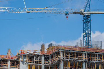 Crane working on construction of building