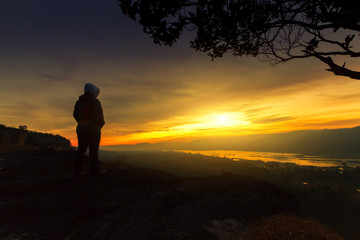  women with looking sunrise alone