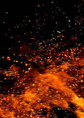 Fototapeta na wymiar sparks of fire on a black background