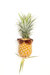 pineapple with sunglasses on white background.