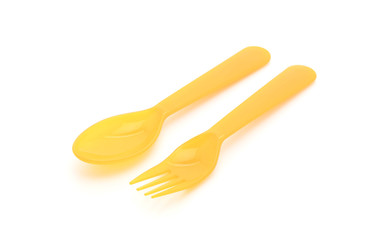 yellow plastic spoon and fork