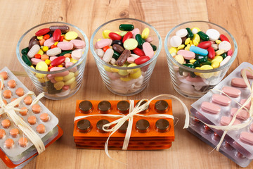 Heap of colorful medical pills and capsules, health care concept