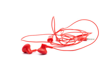 Red earphone on white background