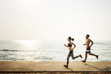 Foto op Canvas Running Exercise Training Healthy Lifestyle Beach Concept © Rawpixel.com