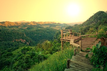 Old wood balcony terrace with mountain view in the morning during sunrise at Baan Ja Bo , Mae Hong Son, Thailand