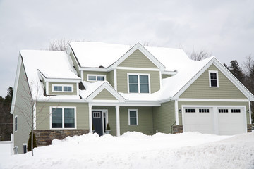 residential house after snow storm in winter