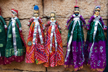 Colorful handmade puppets on display for sale in Jaisalmer, Rajasthan.