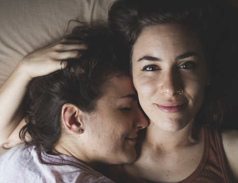 Close up of young couple relaxing on bed