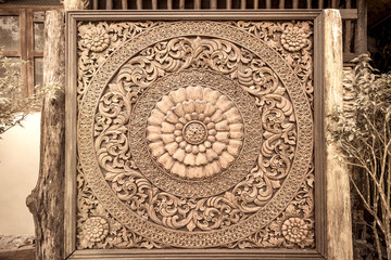 Carved wood decoration in Thailand. Sepia tone