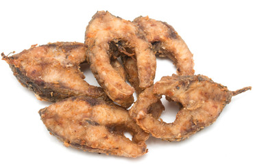 pieces of fried fish on a white background