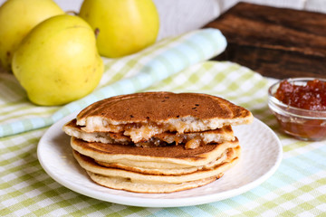 Sweet pancakes made of apple, curd and cinnamon