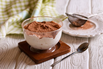 Tiramisu, traditional Italian dessert in glass