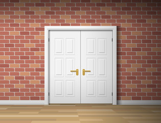 room interior with white door and brick wall