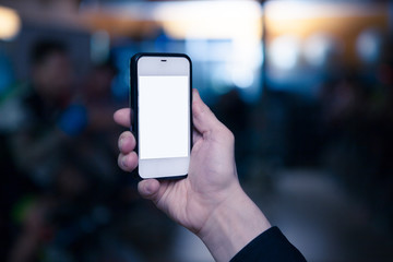 hand with the mobile phone in gym