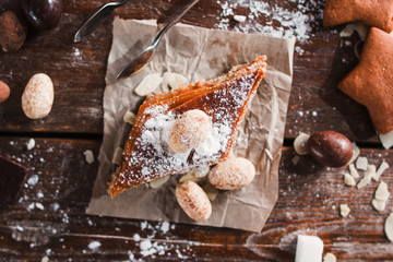 Sweet baklava with nuts on napkin flat lay. Top view on wooden table of baker with sweet ingredients and traditional turkish pastry. Confectionery, eastern dessert concept
