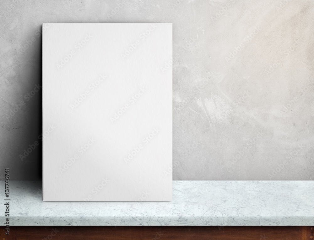 Aufkleber Blank White paper poster on black marble table at grey concrete wall,Template mock up for adding your design and leave space beside frame for adding more text.
