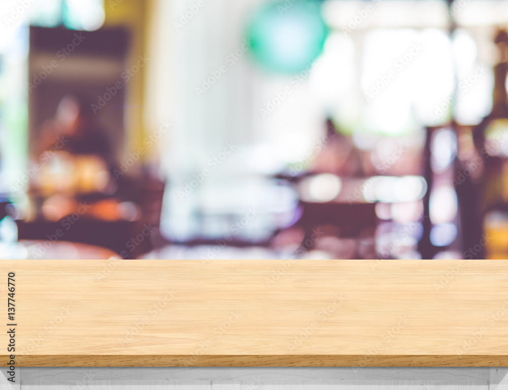Poster empty wood table top with blurred cafe background. mock up for display or montage of product,busines