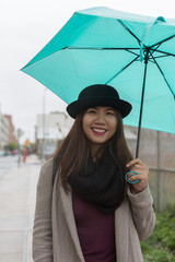 Asian Woman Holding Umbrella While Raining