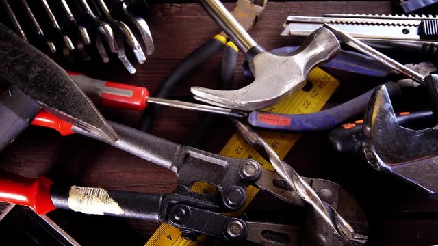 Many old rusty tools on repairman desk