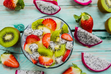 Dragon fruits and other exotic fruits with chia seeds for healthy breakfast. Organic diet and vegetarian food. 
