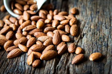 close up Peeled almonds nut  on wooden  background