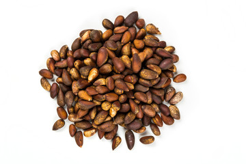 Organic unhulled pine nuts isolated on a white background