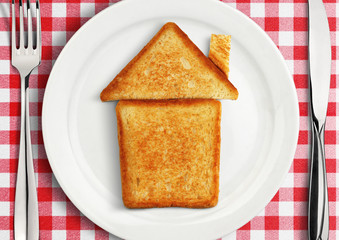 Table setting with house on plate, concept