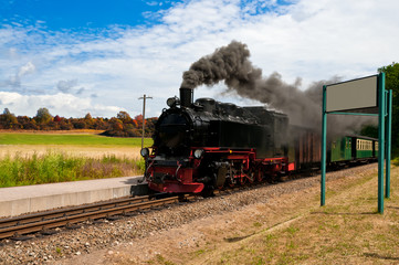 Fototapeta na wymiar Historical steam train in Northern Germany