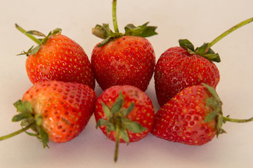 Fresh strawberry ready to eat on a white background.