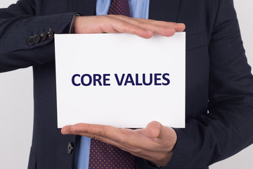 Man showing paper with CORE VALUES text