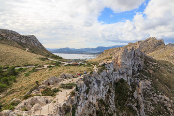 Fototapeta na wymiar Stairs to lookout point Mirador Es Colomer at Cap de Formentor and Port de pollenca mountain panorama, Majorca, Spain