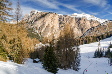 Fototapeta na wymiar Sunny view of Dolomite Alps near Canazei of Val di Fassa, Trentino-Alto-Adige region, Italy.