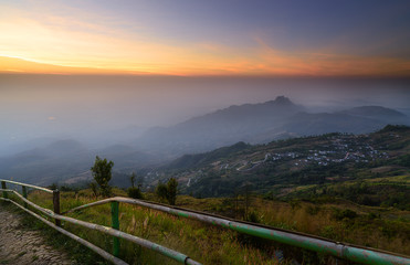 Fototapeta na wymiar Mountain landscape on sunrise and foggy.