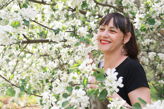 girl in a spring apple flower garden