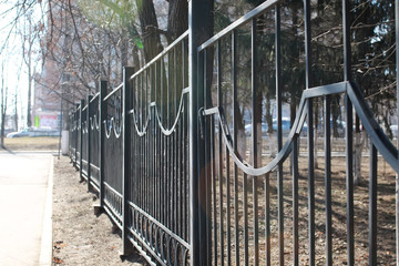 pedestrian sidewalk along the fence